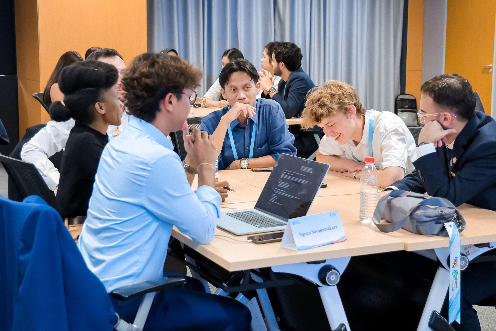 Finalists discuss cultural diversity and global governance in small groups during the Youth Salon.