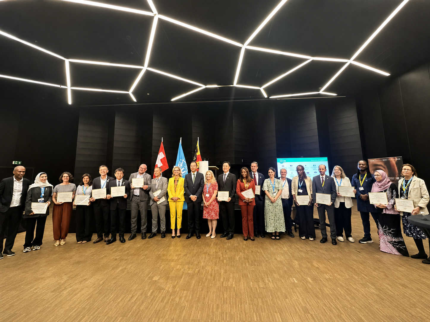 GSLDC representatives and international partners pose on stage during the WSIS Forum 2026 ceremony.