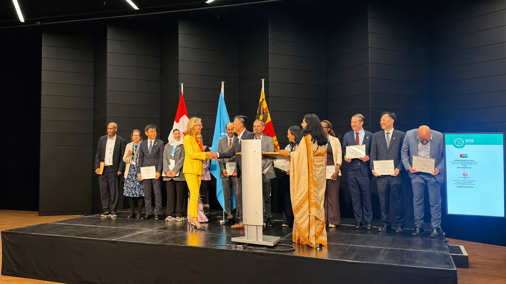 International delegates and representatives on stage during the WSIS Forum 2026 ceremony.