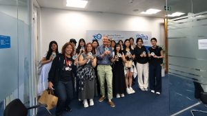 Youth delegates and IHA CEO Eddie Rich pose for a group photo at the International Hydropower Association headquarters.