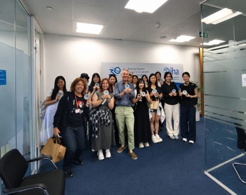 Youth delegates and IHA CEO Eddie Rich pose for a group photo at the International Hydropower Association headquarters.