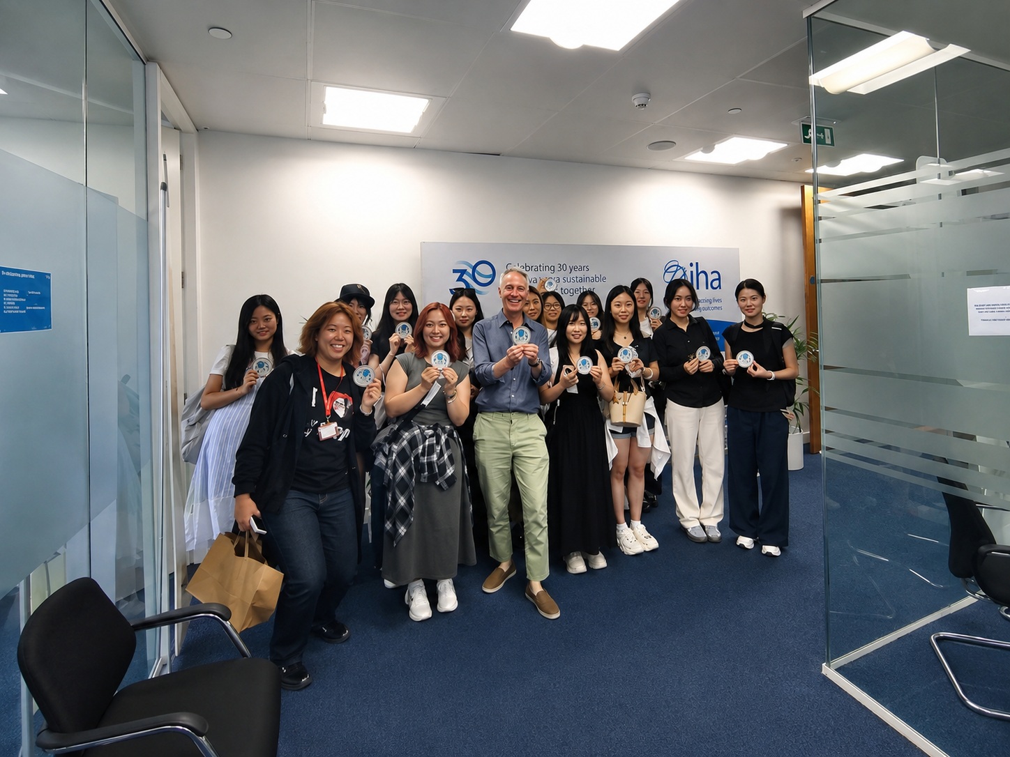 Youth delegates and IHA CEO Eddie Rich pose for a group photo at the International Hydropower Association headquarters.